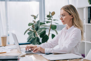 Young businesswoman working on laptop