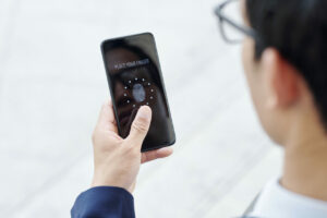 businessman using multi-factor authentication on smart phone