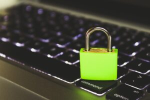 Green lock sitting on a keyboard
